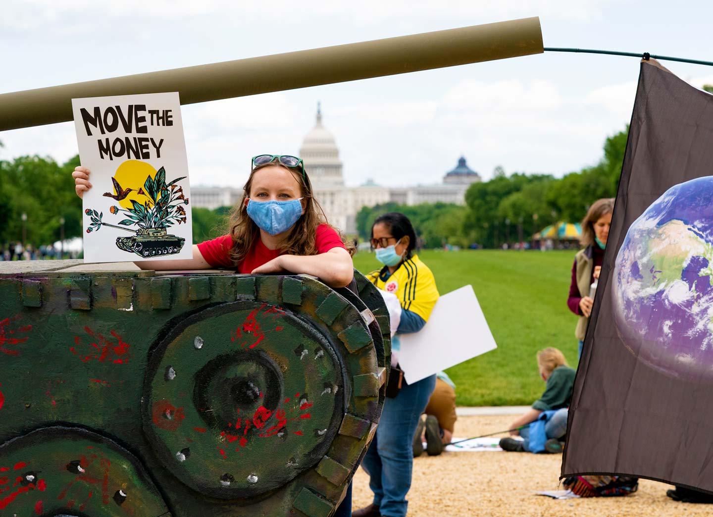 Woman holding a sign that says