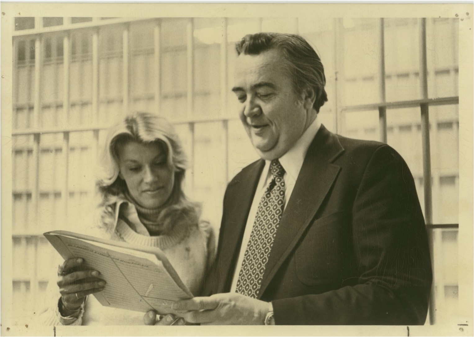 archival photo of bonnie looking at papers