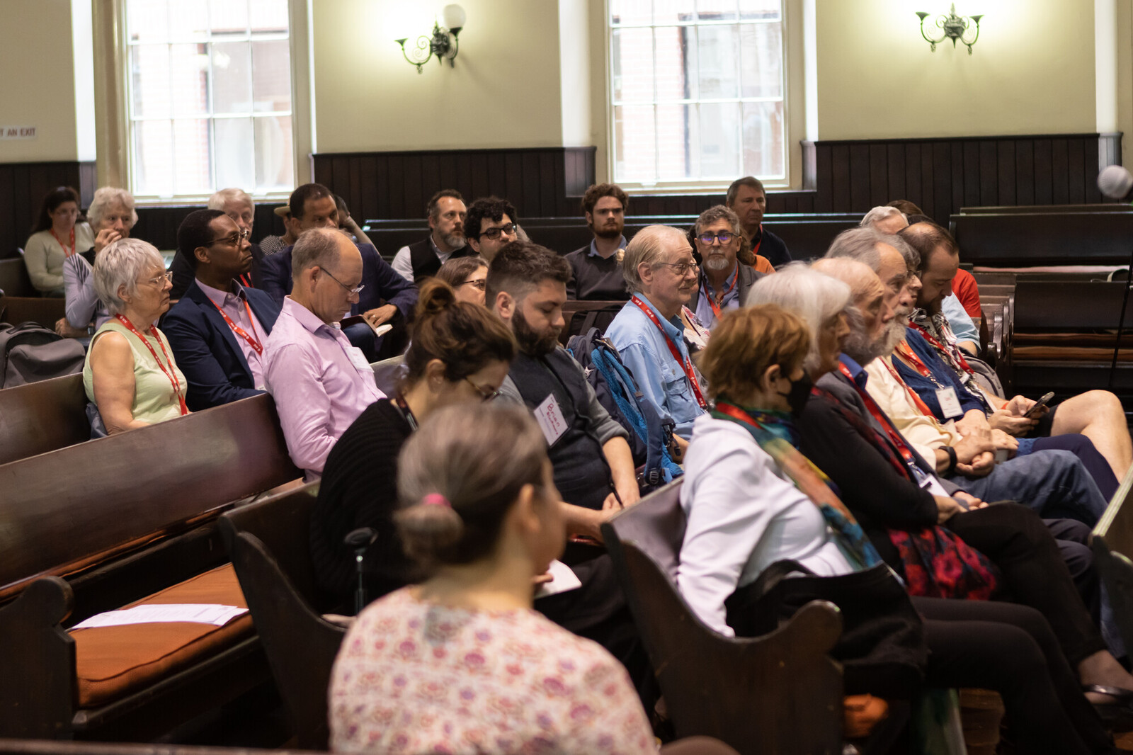 A group of Quakers gather for worship in a Meeting House.