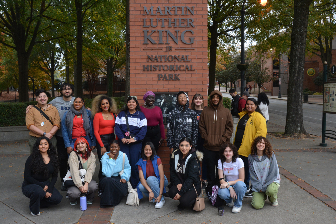 photo of youth posing in front of MLK national park monument