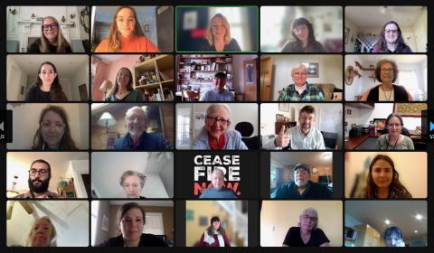 Screenshot of 25 participants in the 21st Action Hour smiling at their cameras
