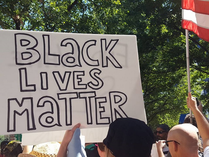 Black Lives Matter sign at protest in Charlotte, photo by Lori Khamala