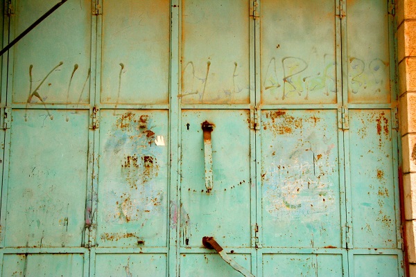 “KILL ALL ARABS” – graffiti scrawled on the door of a closed Palestinian shop in Hebron.