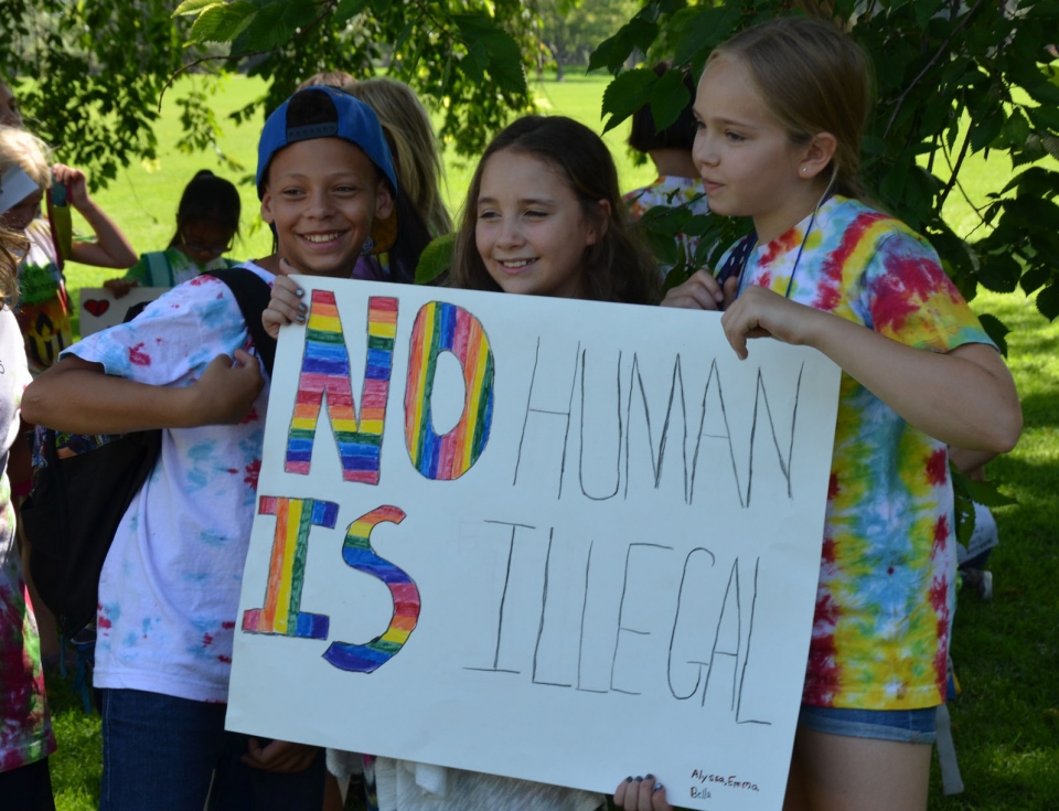 Children hold up a sign as part of a children's march against immigrant detention in Denver, Colorado.