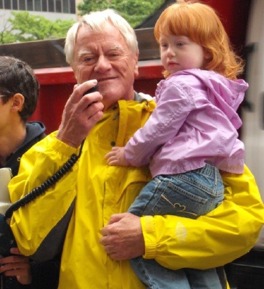 George and his grandchild Ella at an Earth Quaker Action Team rally in 2011. Photo courtesy of George Lakey. 