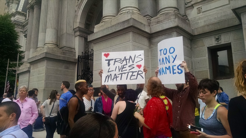 Sign reading "Trans Lives Matter" at the "Philly stands with Orlando" march in June 2016. Photo by Ralph Medley / AFSC.