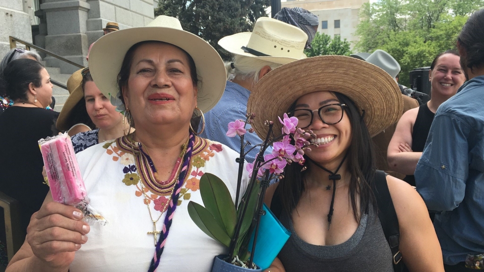 Juana Armijo, left, joins friends in celebrating the passage of Colorado’s agricultural workers bill of rights. Photo: Jennifer Piper/AFSC